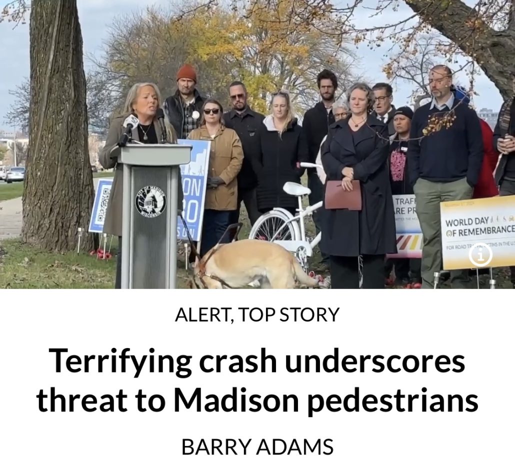 Woman at podium with government officials behind her giving speech.